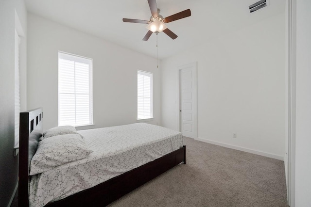 bedroom with ceiling fan and carpet