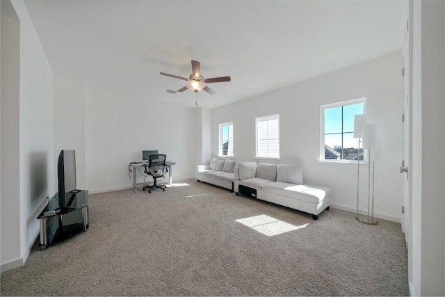 living room featuring light colored carpet and ceiling fan