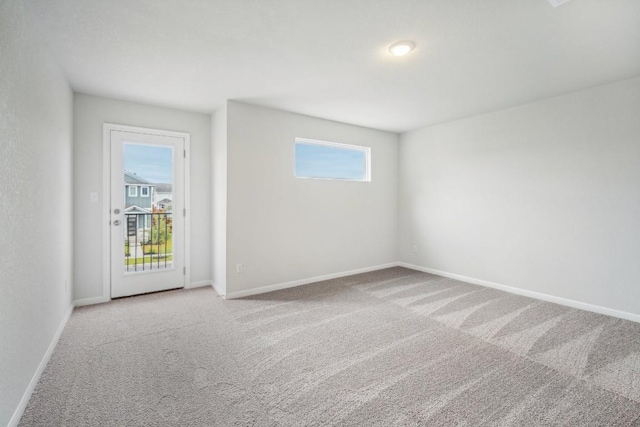 unfurnished room featuring carpet