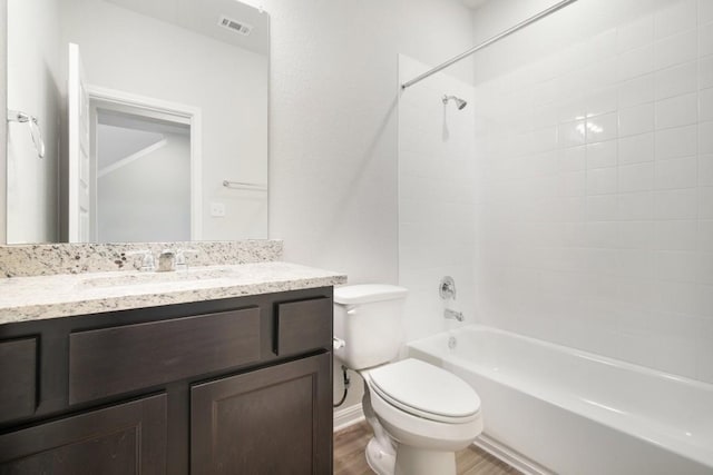 full bathroom with wood-type flooring, toilet, vanity, and  shower combination