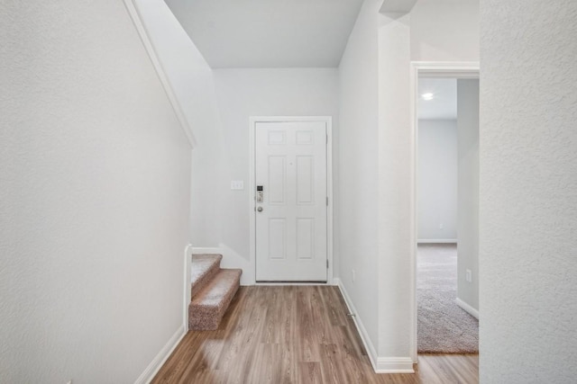 entryway with light hardwood / wood-style flooring