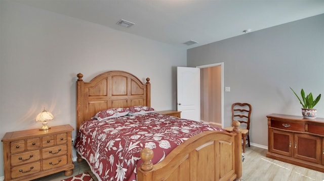 bedroom featuring light hardwood / wood-style floors