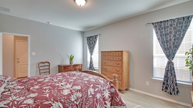 bedroom with light hardwood / wood-style flooring