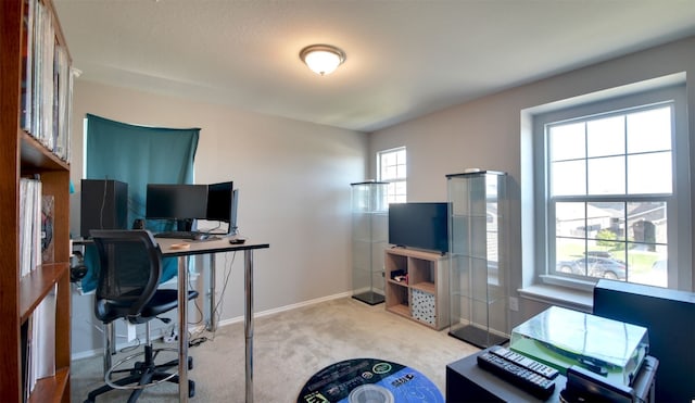 carpeted home office with plenty of natural light