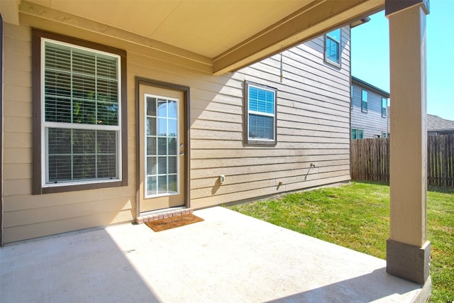 entrance to property featuring a patio