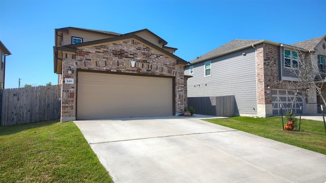 view of front of property with a front yard and a garage