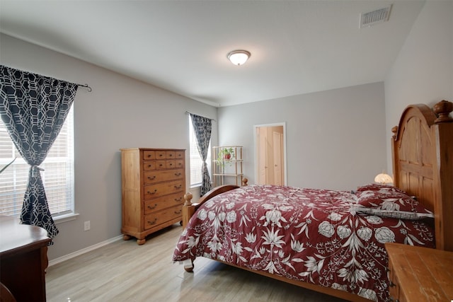 bedroom with light wood-type flooring