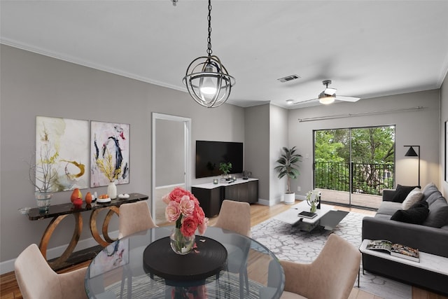 living room with ceiling fan, crown molding, and light wood-type flooring