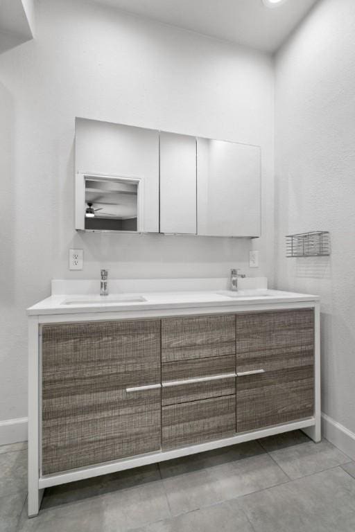 bathroom with vanity and tile patterned floors