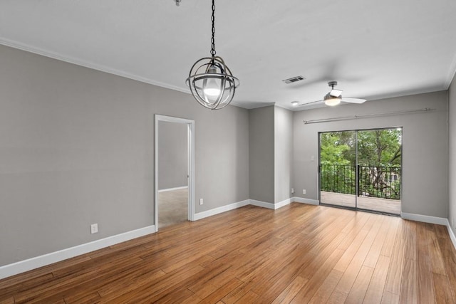 spare room with ceiling fan, light wood-type flooring, and crown molding