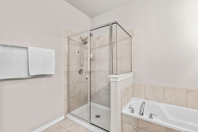 bathroom featuring separate shower and tub and tile patterned flooring