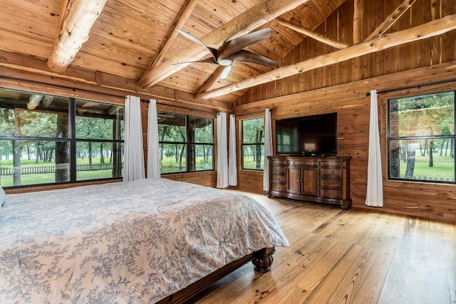 bedroom with wooden ceiling, multiple windows, and light hardwood / wood-style flooring