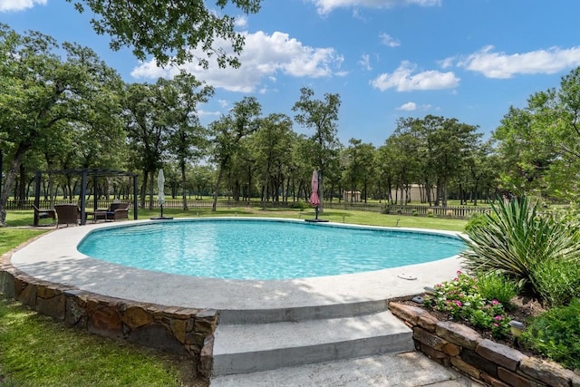 view of pool featuring a yard and a pergola