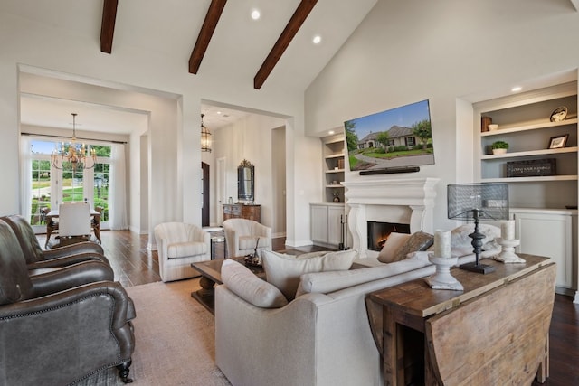 living room featuring built in shelves, an inviting chandelier, high vaulted ceiling, beamed ceiling, and hardwood / wood-style floors