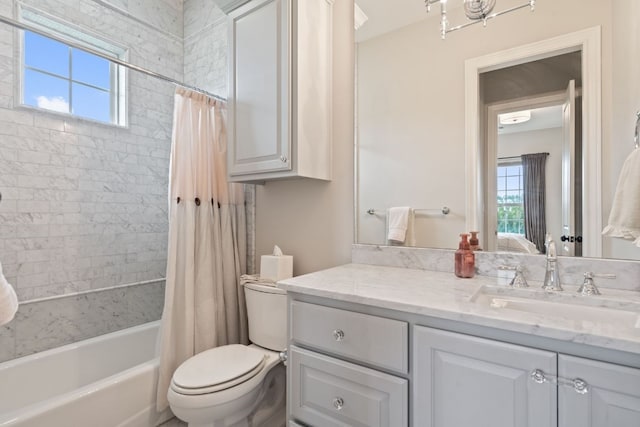 full bathroom with vanity, a wealth of natural light, shower / tub combo with curtain, and toilet