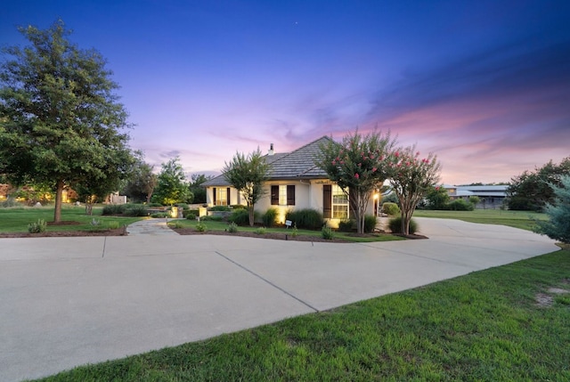 view of front of home with a yard