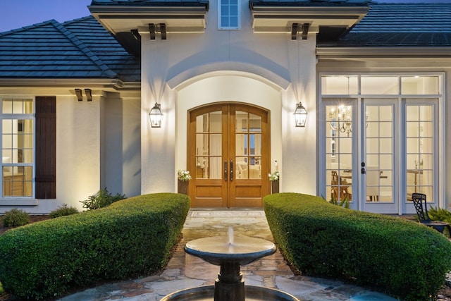 property entrance featuring french doors