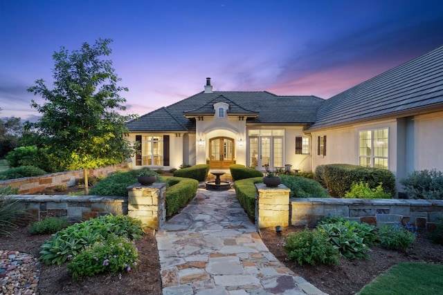 french country home featuring french doors