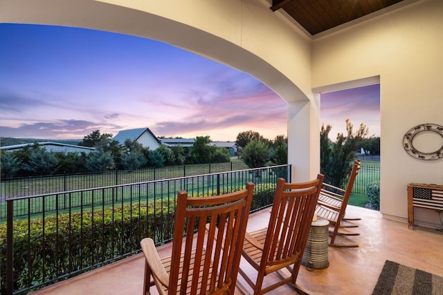 view of patio terrace at dusk