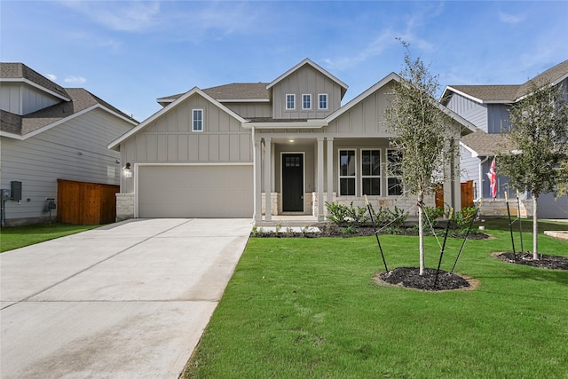 craftsman house featuring a garage and a front yard