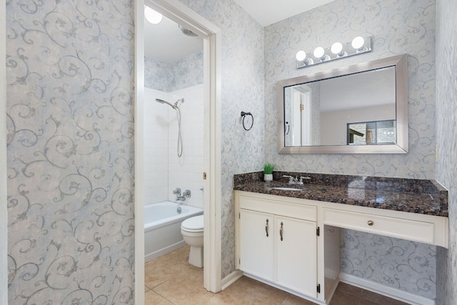 full bathroom featuring tile patterned floors, toilet, vanity, and tiled shower / bath