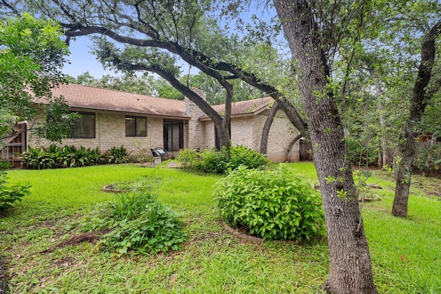 ranch-style home with a front yard