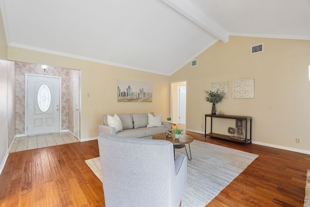 living room with hardwood / wood-style floors and lofted ceiling with beams