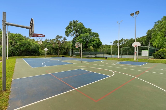 view of basketball court featuring tennis court