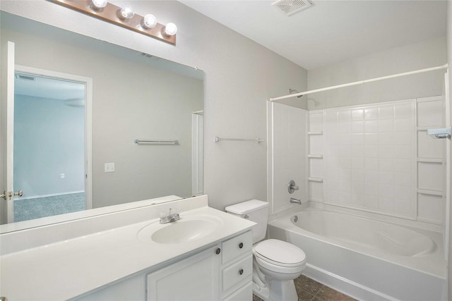 full bathroom featuring tile patterned floors, toilet, vanity, and  shower combination