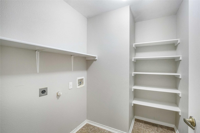 laundry area with hookup for a washing machine, electric dryer hookup, and hookup for a gas dryer