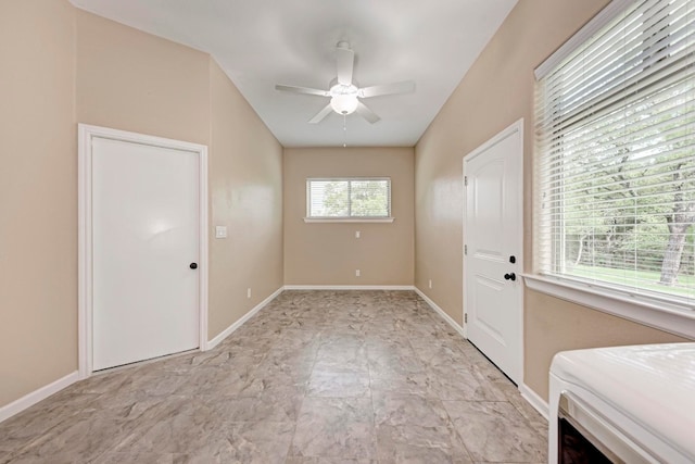 interior space featuring ceiling fan