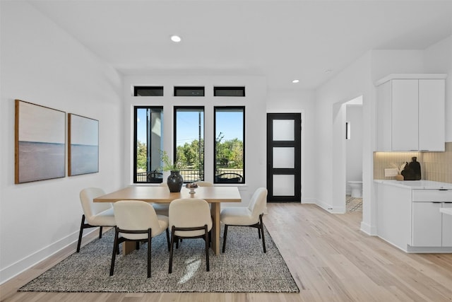 dining area with light hardwood / wood-style flooring