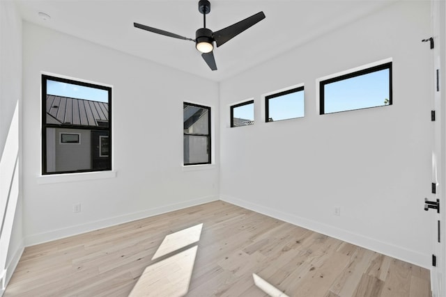 unfurnished room featuring ceiling fan and light hardwood / wood-style floors