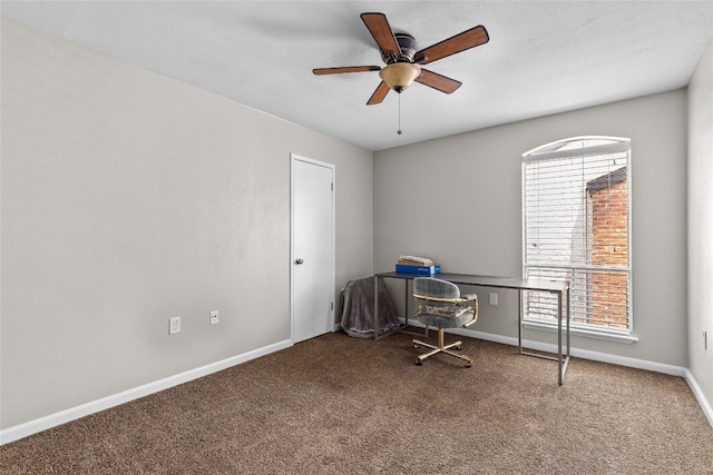 unfurnished office featuring carpet flooring and ceiling fan