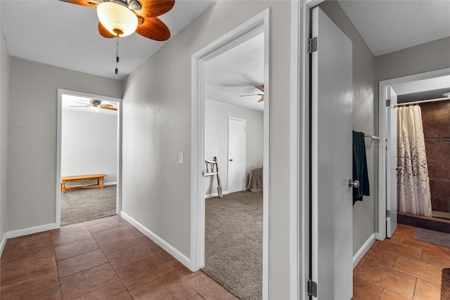 hallway featuring carpet