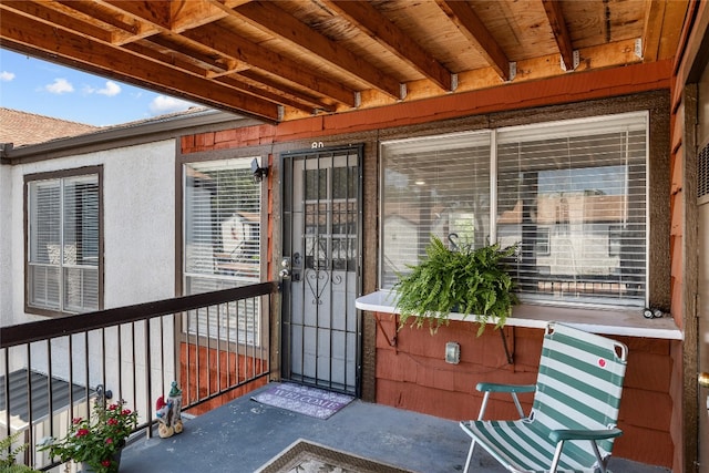 doorway to property featuring a balcony