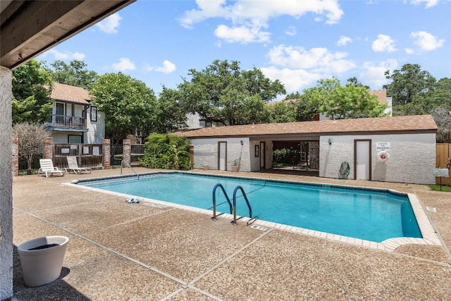 view of swimming pool with a patio area