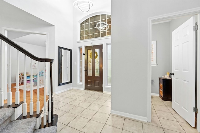 tiled foyer entrance featuring plenty of natural light