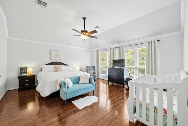 bedroom with ceiling fan, crown molding, and dark hardwood / wood-style floors