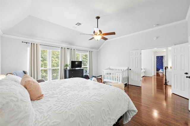 bedroom featuring vaulted ceiling, ceiling fan, dark hardwood / wood-style floors, and ornamental molding