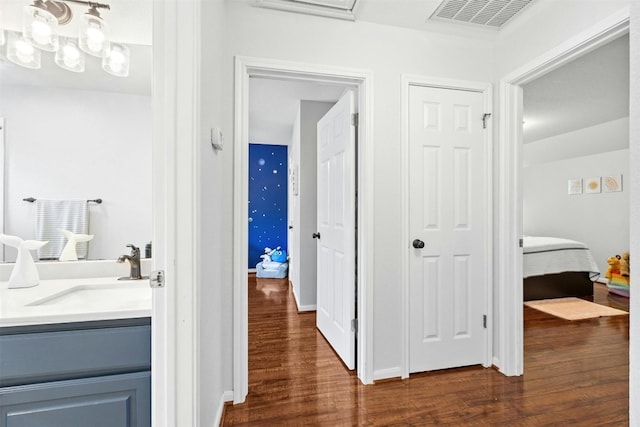 bathroom featuring hardwood / wood-style flooring and vanity