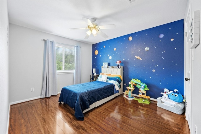 bedroom with ceiling fan and wood-type flooring