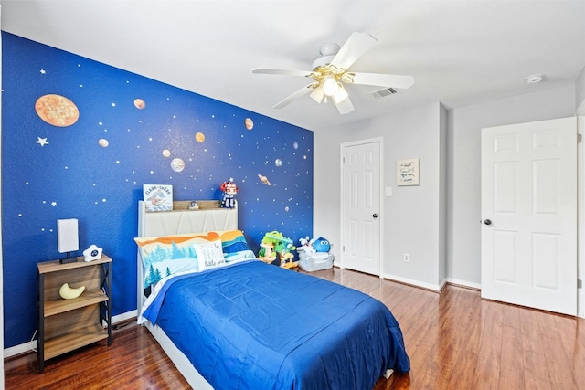 bedroom featuring ceiling fan and hardwood / wood-style floors