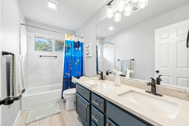 full bathroom featuring shower / bath combination with curtain, vanity, and toilet