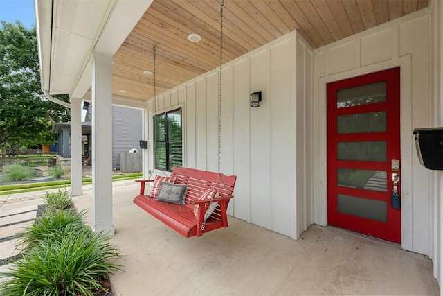 doorway to property featuring covered porch