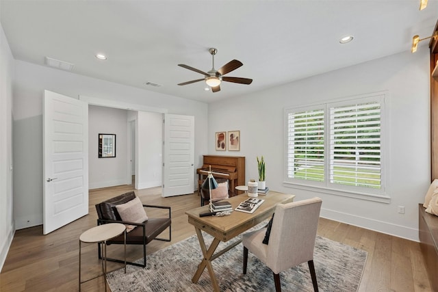 office area featuring wood-type flooring and ceiling fan