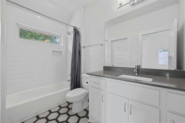 full bathroom with vanity, toilet, and shower / tub combo