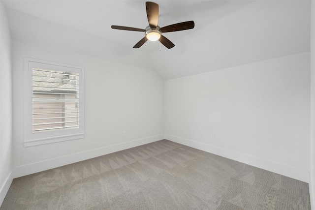 bonus room featuring ceiling fan, light carpet, and vaulted ceiling