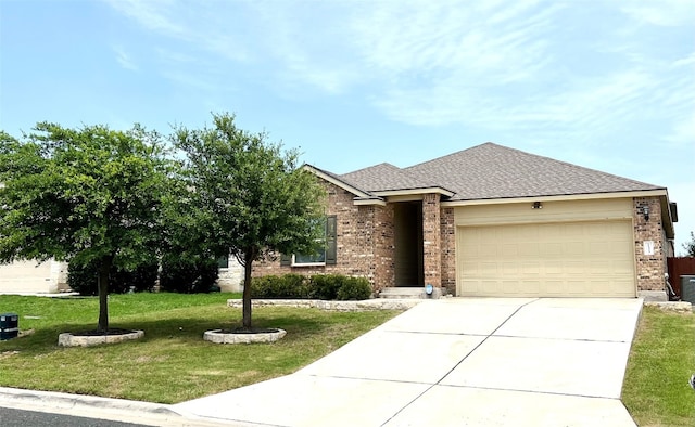 view of front of house with a garage and a front lawn