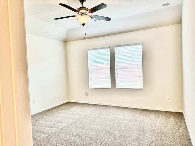 unfurnished room featuring ceiling fan and carpet floors